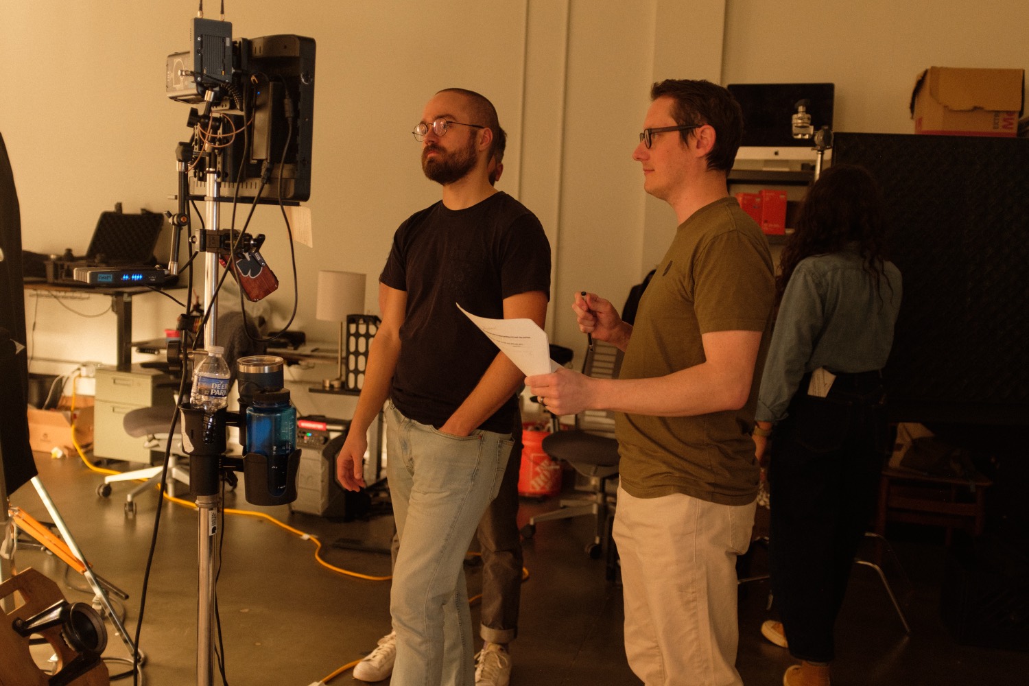 Creative team reviewing the shot list on set.